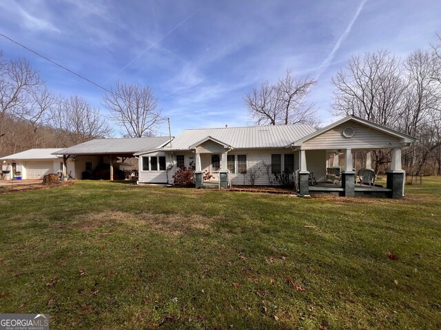 view of front facade with covered porch and a front lawn