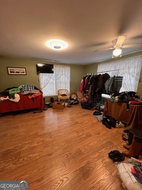 bedroom with wood finished floors and ceiling fan