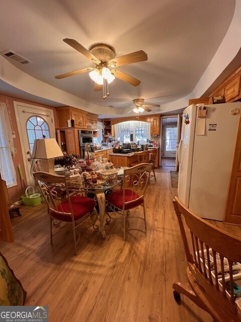 dining room with visible vents and light wood-style floors