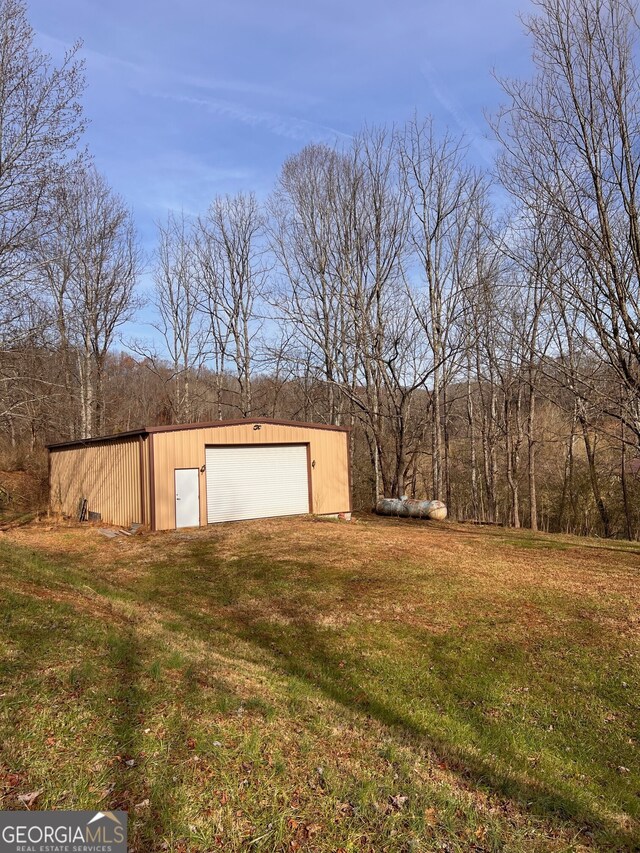 back of house with a porch and a lawn