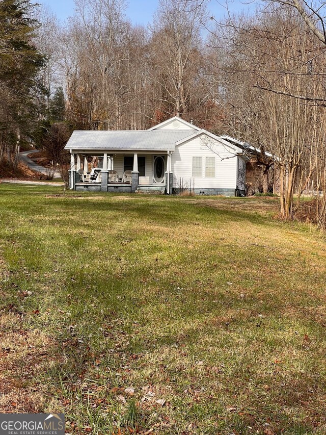 view of outdoor structure with a lawn