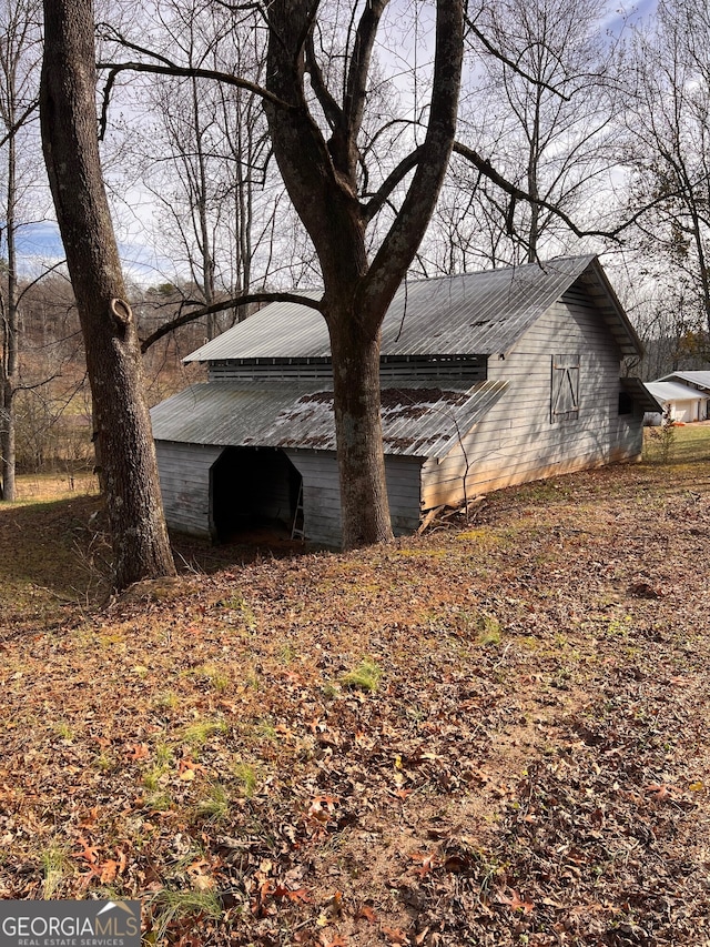 view of property exterior with metal roof