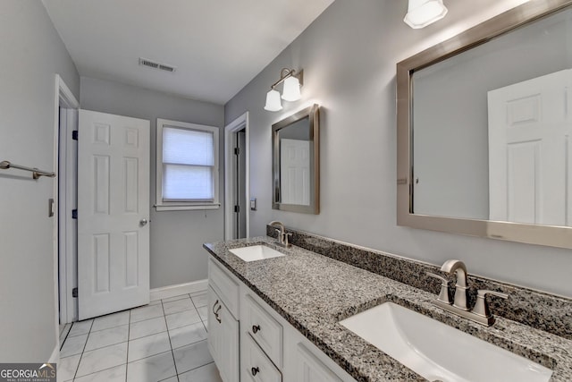 bathroom featuring tile patterned floors and vanity