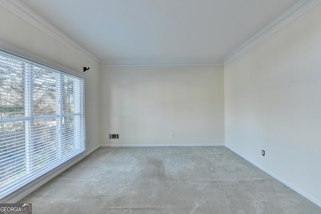 carpeted spare room with crown molding