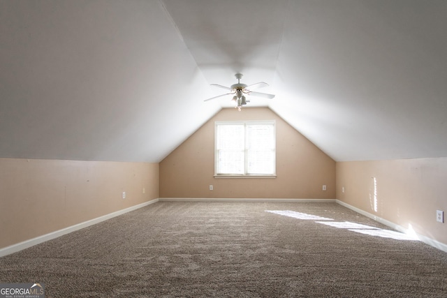 additional living space with carpet flooring, vaulted ceiling, and ceiling fan