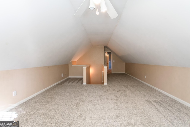 bonus room with ceiling fan, carpet, and vaulted ceiling