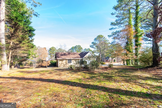 view of yard with a carport