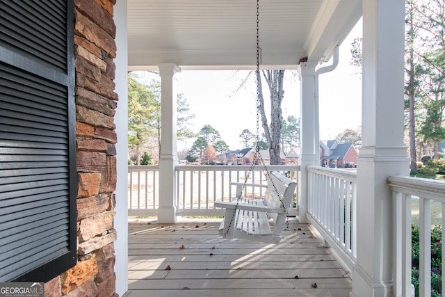 wooden terrace featuring a porch