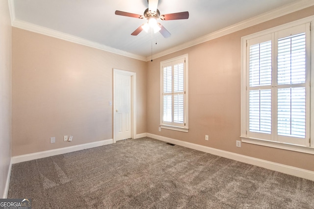 carpeted empty room with plenty of natural light, ceiling fan, and crown molding