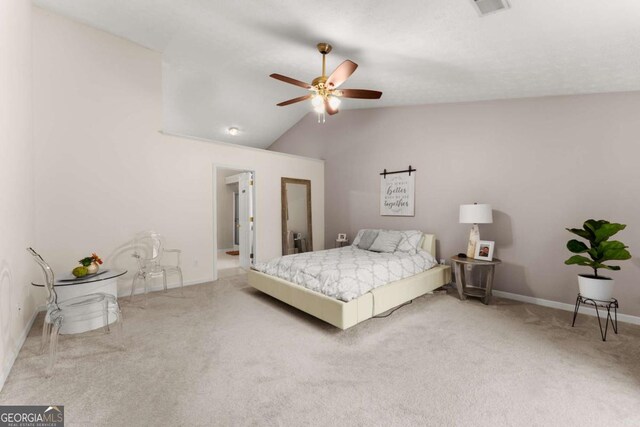 bedroom with ceiling fan, carpet, and lofted ceiling