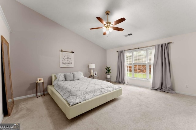 bedroom featuring light colored carpet, ceiling fan, and lofted ceiling