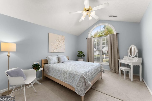 bedroom featuring ceiling fan, light colored carpet, and lofted ceiling