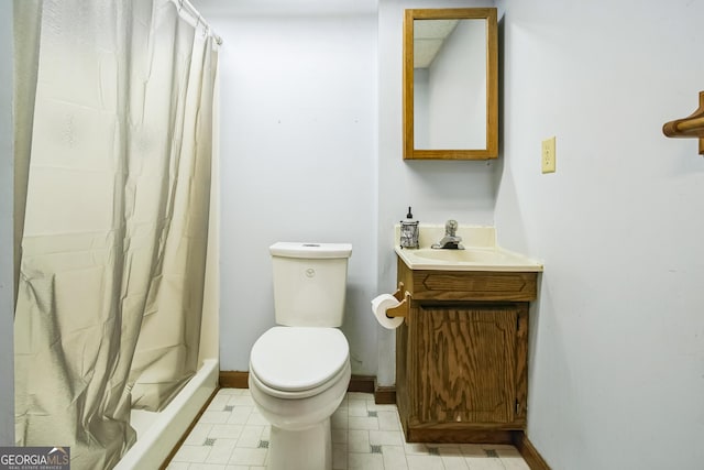 bathroom with vanity, toilet, and curtained shower