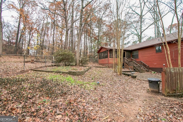 view of yard featuring a sunroom