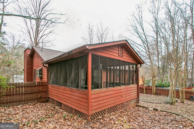 view of home's exterior featuring a sunroom