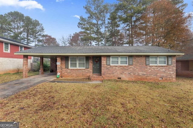 ranch-style house with a front yard and a carport