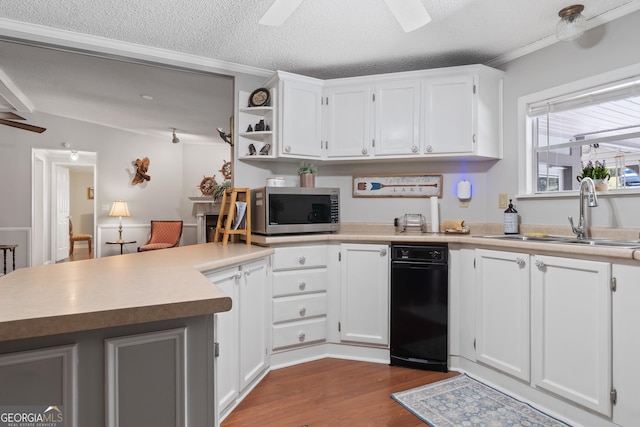 kitchen with white cabinets, hardwood / wood-style floors, and sink