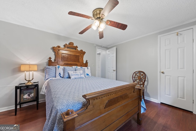 bedroom with a textured ceiling, dark hardwood / wood-style flooring, ceiling fan, and ornamental molding