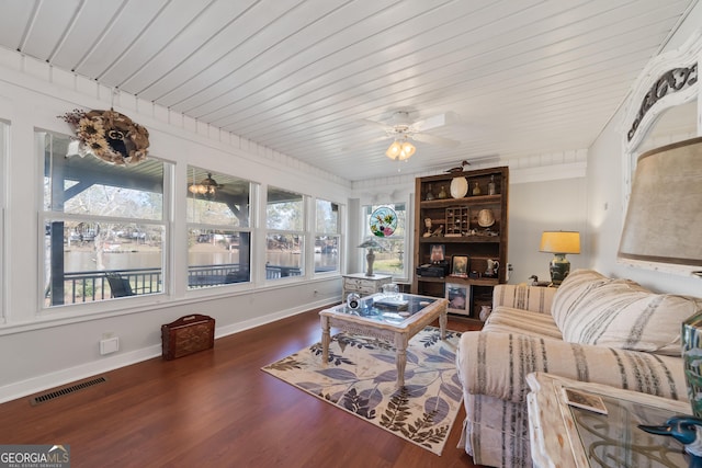 living room featuring dark hardwood / wood-style floors, a healthy amount of sunlight, wood ceiling, and ceiling fan