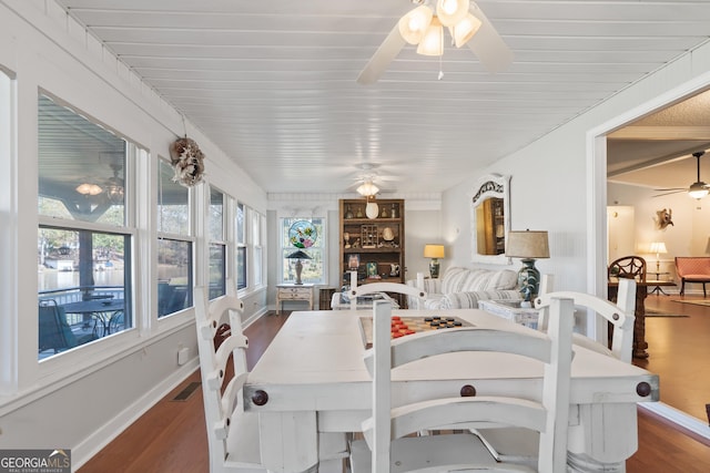 dining area with dark hardwood / wood-style flooring and a wealth of natural light