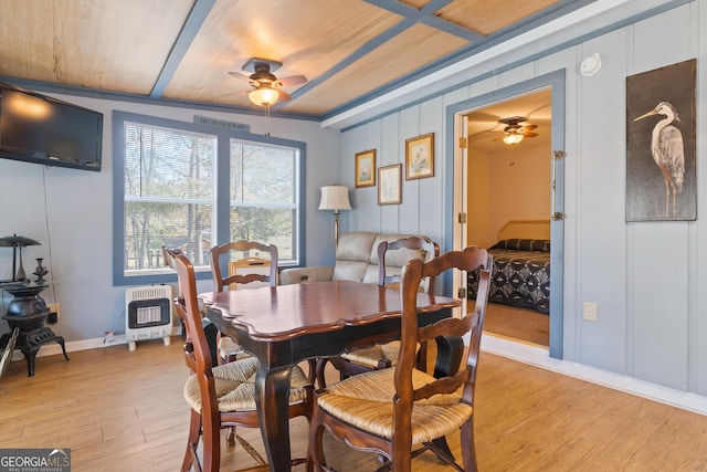 dining room with ceiling fan, wooden ceiling, heating unit, light hardwood / wood-style floors, and ornamental molding