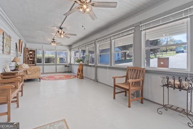 sunroom featuring plenty of natural light and ceiling fan