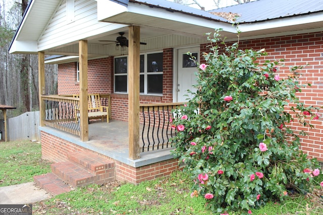 wooden terrace featuring ceiling fan and a porch