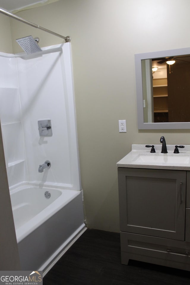 bathroom featuring shower / bath combination, vanity, and hardwood / wood-style flooring