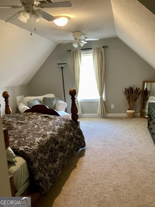 carpeted bedroom featuring ceiling fan, a textured ceiling, and vaulted ceiling