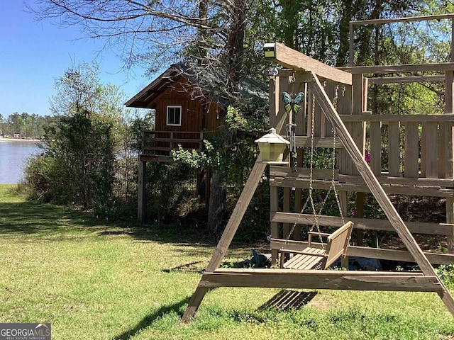 view of playground featuring a water view and a yard