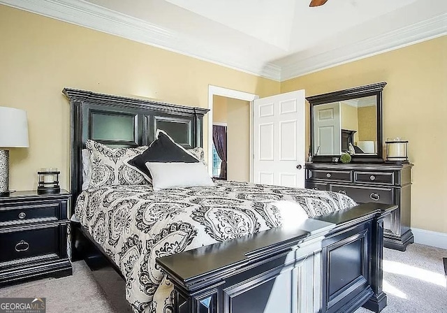 carpeted bedroom with ceiling fan and crown molding