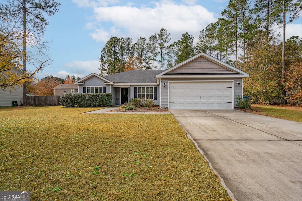 ranch-style home with a front yard and a garage