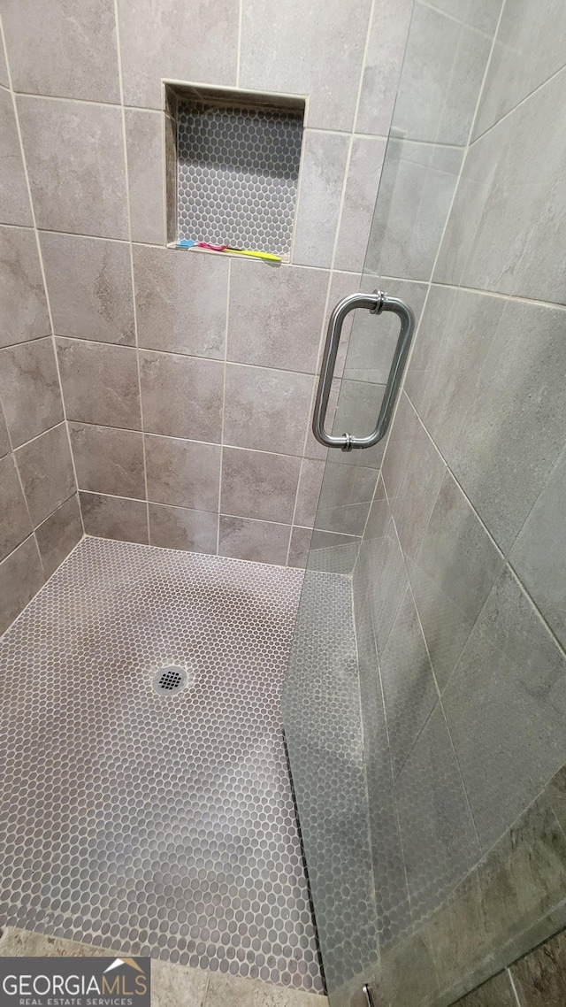 bathroom featuring walk in shower