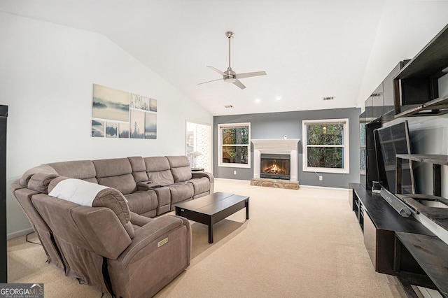 living room featuring light carpet, vaulted ceiling, and ceiling fan