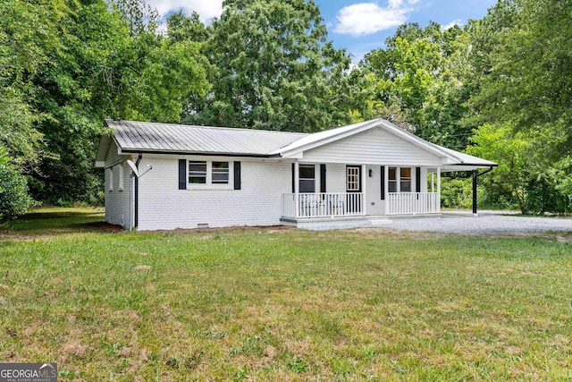 ranch-style house featuring a porch and a front lawn