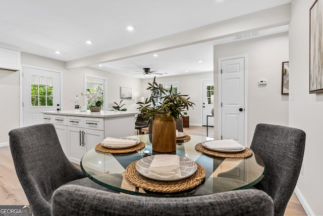 dining area featuring ceiling fan and light wood-type flooring