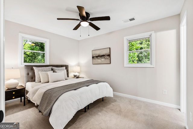 carpeted bedroom featuring ceiling fan