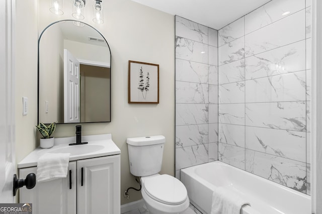 full bathroom with vanity, toilet, and tiled shower / bath combo