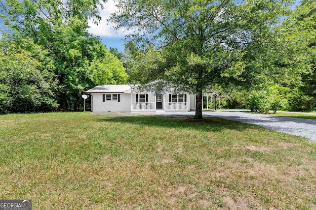 view of front facade with covered porch and a front yard