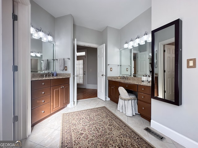 bathroom with vanity and tile patterned flooring