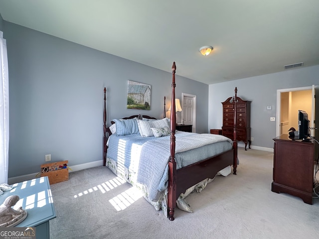 bedroom featuring light carpet