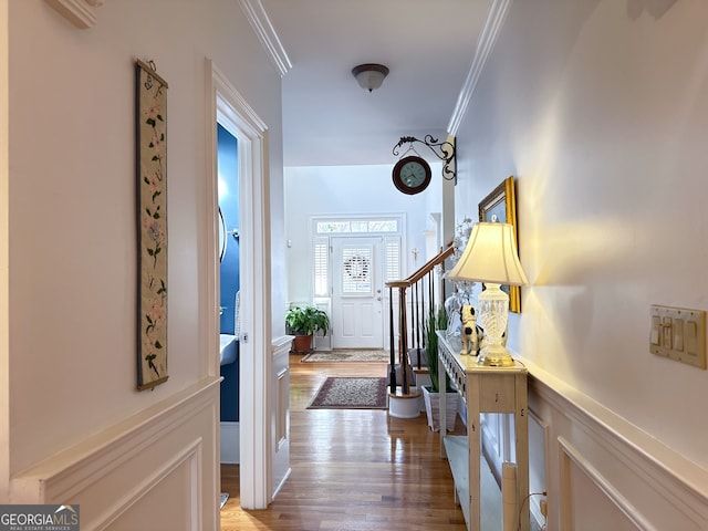 interior space featuring crown molding and wood-type flooring