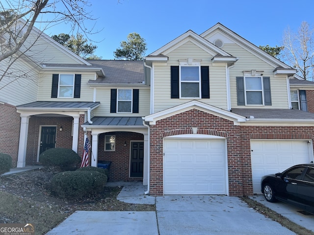 view of front of property with a garage