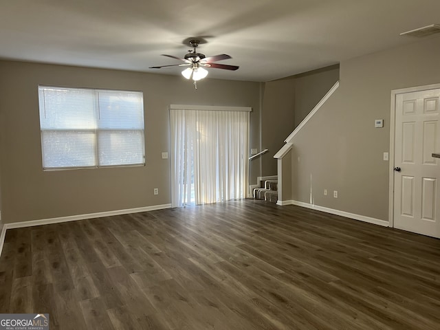 113 Ellis Dr, Conyers, GA 30012 - unfurnished living room with ceiling fan and dark wood-style flooring