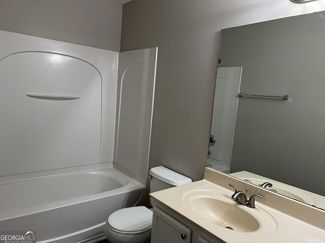 full bathroom featuring bathtub / shower combination, vanity, and toilet