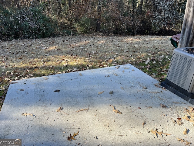 view of yard with central air condition unit