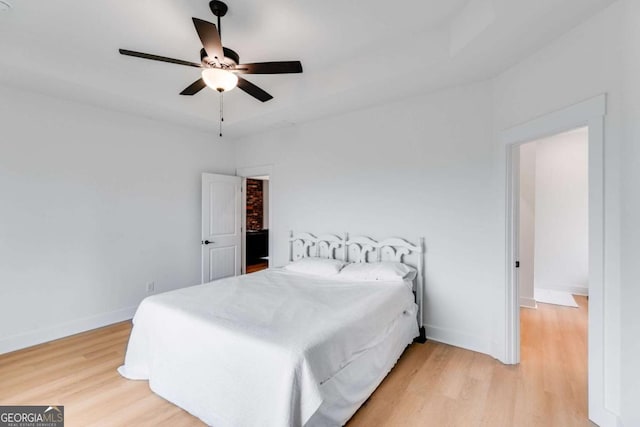 bedroom featuring ceiling fan and light hardwood / wood-style floors