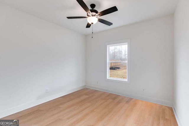 unfurnished room featuring ceiling fan and light hardwood / wood-style floors