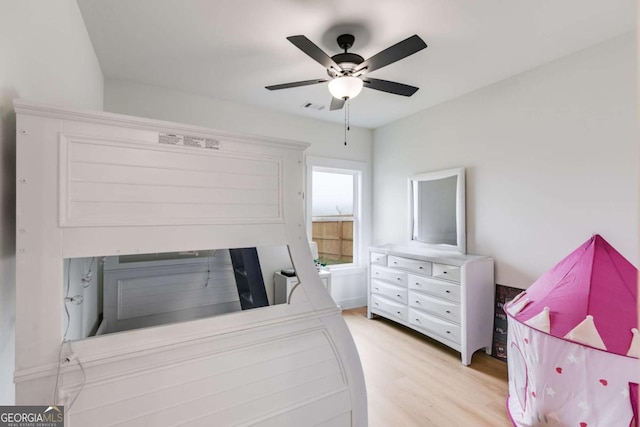 bedroom with ceiling fan and light hardwood / wood-style flooring