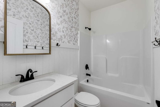 full bathroom featuring vanity, toilet, and shower / washtub combination